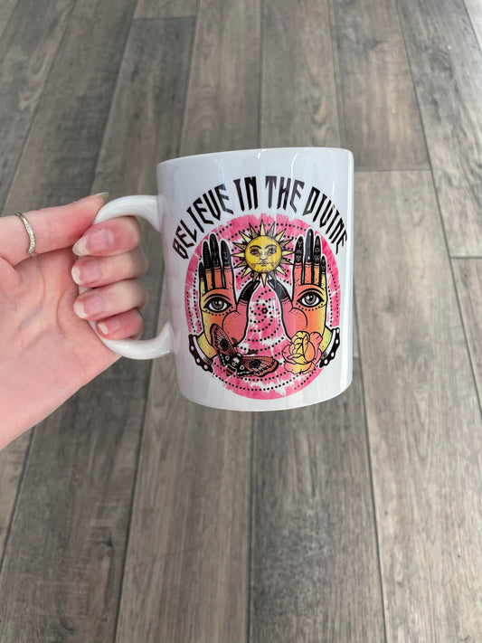 believe in the devine mug