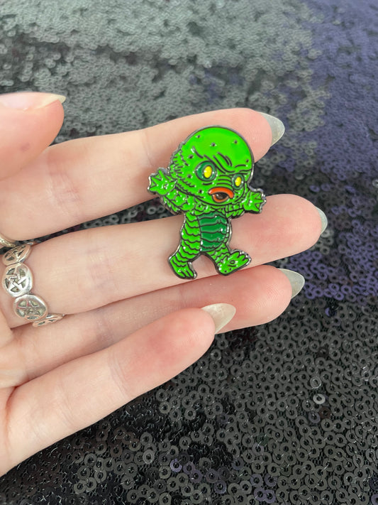 Creature enamel pin